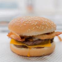 Bacon Roadhouse · Two hand-seasoned, 100% beef hamburger patties topped with crispy bacon, American cheese, me...