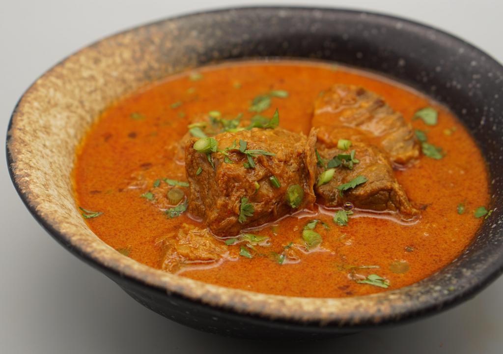Kashmiri Lamb Curry · Gluten free. Very spicy. Cubed lamb, ground spices, saffron, ghee, yogurt.