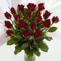 Dozen Red Roses · One Dozen Long Red Roses arranging in the glass calssy vases.