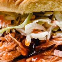 Pork Bbq · A large portion of our delicious Pork BBQ topped with a generous amount of our house made co...