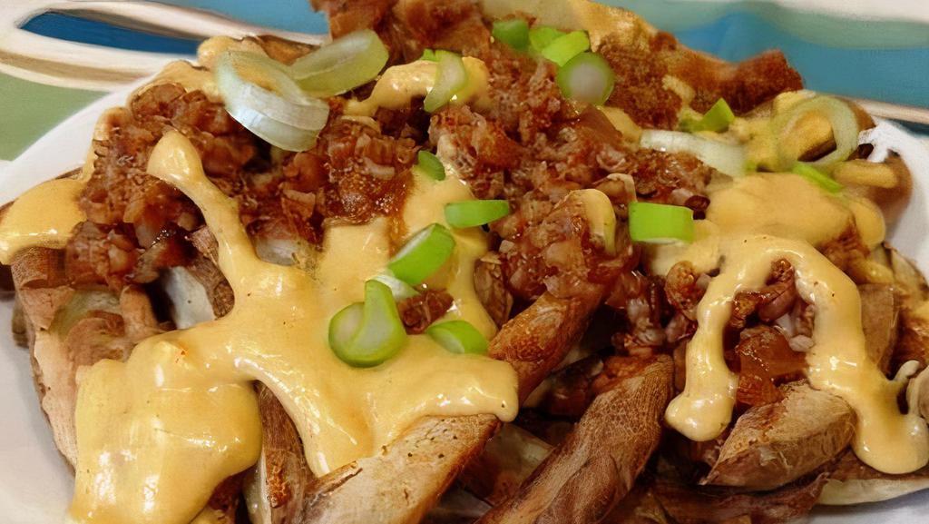 Chili Cheese Fries · A large order of our fresh hand-cut fries smothered with our home made chili and nacho cheese.