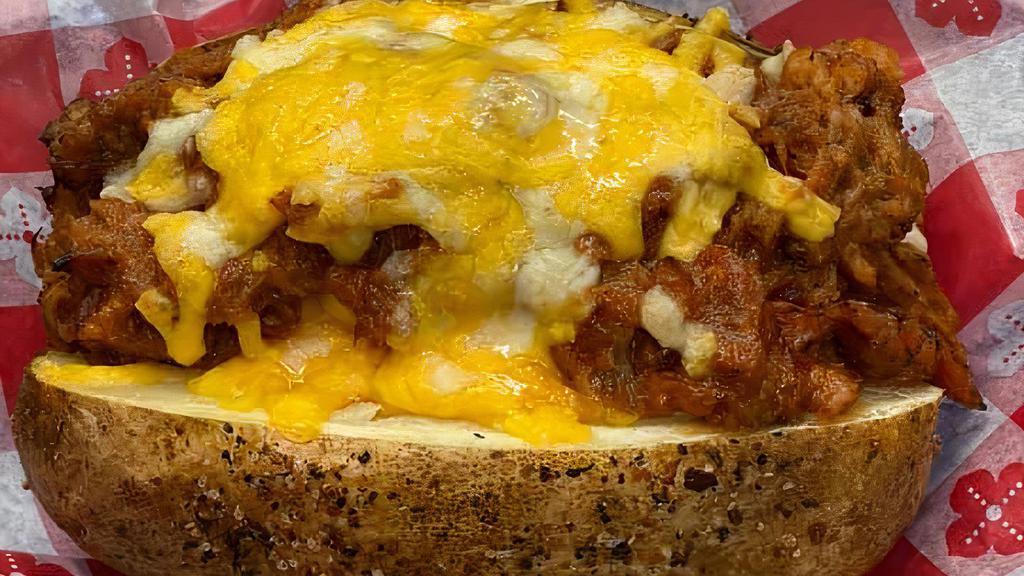 Bbq Baked Potato · Our Large Idaho Potato, oven baked in our special blend of spices then split and filled with butter and a three cheese blend. Topped with our meaty BBQ, even more cheese and finished with our house made coleslaw.