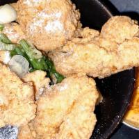 Chicken Karaage · Asian marinated chicken thigh, lightly breaded and fried. Served with scallions and  spicy J...