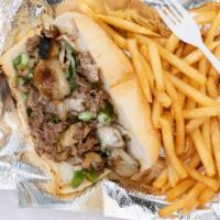 Philly Cheese Steak Sandwich · Prepared with grilled onions, mushrooms, green peppers, and Swiss cheese.