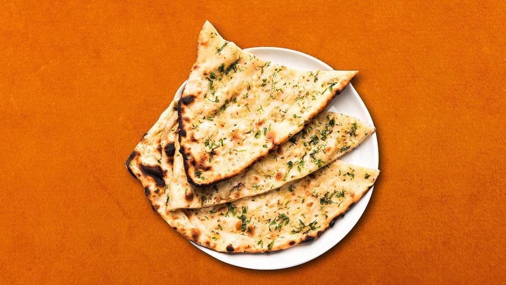 Garlic Naan  · House made hand pulled and leavened dough, loaded with fine chopped garlic and baked to perfection in an Indian clay oven.