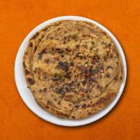 Chilli Onion Naan  · House made hand pulled and leavened dough, filled with onions, green chillies and baked to p...
