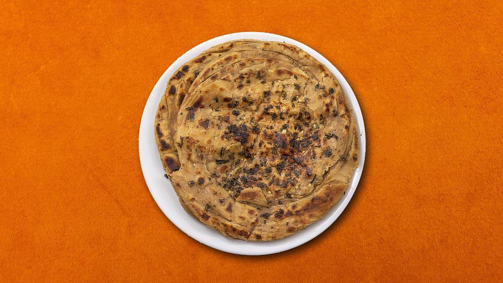 Chilli Onion Naan  · House made hand pulled and leavened dough, filled with onions, green chillies and baked to perfection in an Indian clay oven