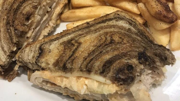 Blake'S Famous Grilled Reuben · With your choice of tender lean slices of corned beef or turkey with sauerkraut, Swiss cheese and Thousand Island dressing on grilled rye bread.