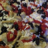 Small Greek Pizza · Topped with spinach, sliced tomatoes, black olives and feta.