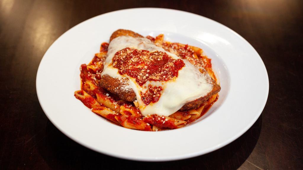 Chicken Parmesan · Tender breaded chicken cutlet topped with provolone cheese and our own marinara sauce. Served with penne or angel hair pasta.