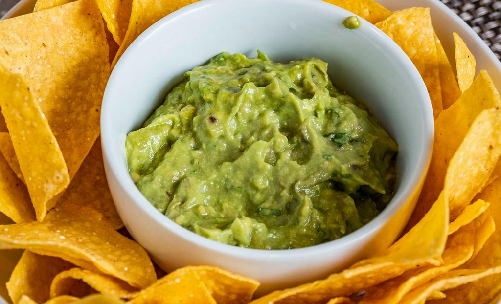 Chips And Guac · A pint of our fresh smashed guacamole along with a bag of our delicious tortilla chips