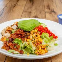 Southwest Cobb Salad · Mesquite-grilled chicken breast, crisp bacon, fresh avocado, fire-roasted red peppers, crumb...