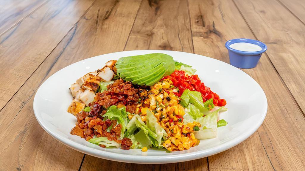 Southwest Cobb Salad · Mesquite-grilled chicken breast, crisp bacon, fresh avocado, fire-roasted red peppers, crumbled bleu cheese on chilled hearts of romaine. Served with your choice of dressing.