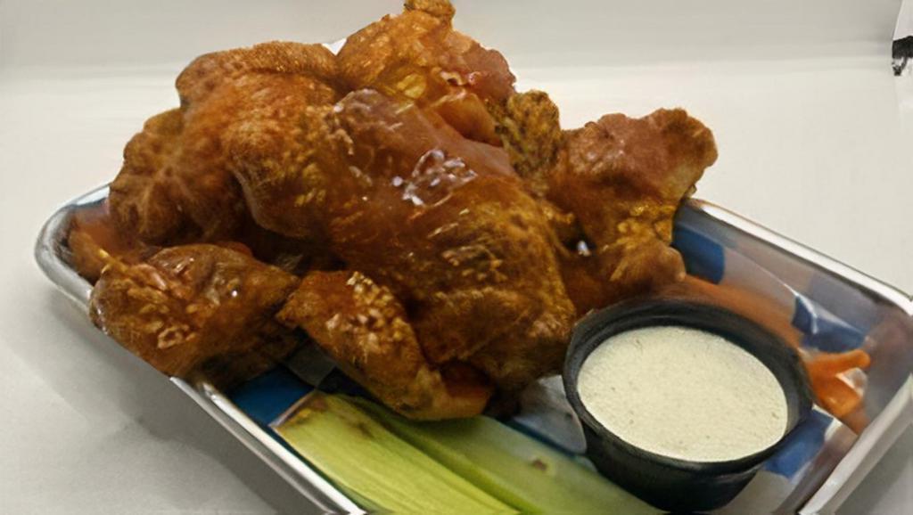 Awc 5 Boneless Wings · 5 Boneless wings brined for 24 hours, battered to order and tossed in the sauce of your choice. Served with carrots, celery and your choice of ranch or blue cheese dressing