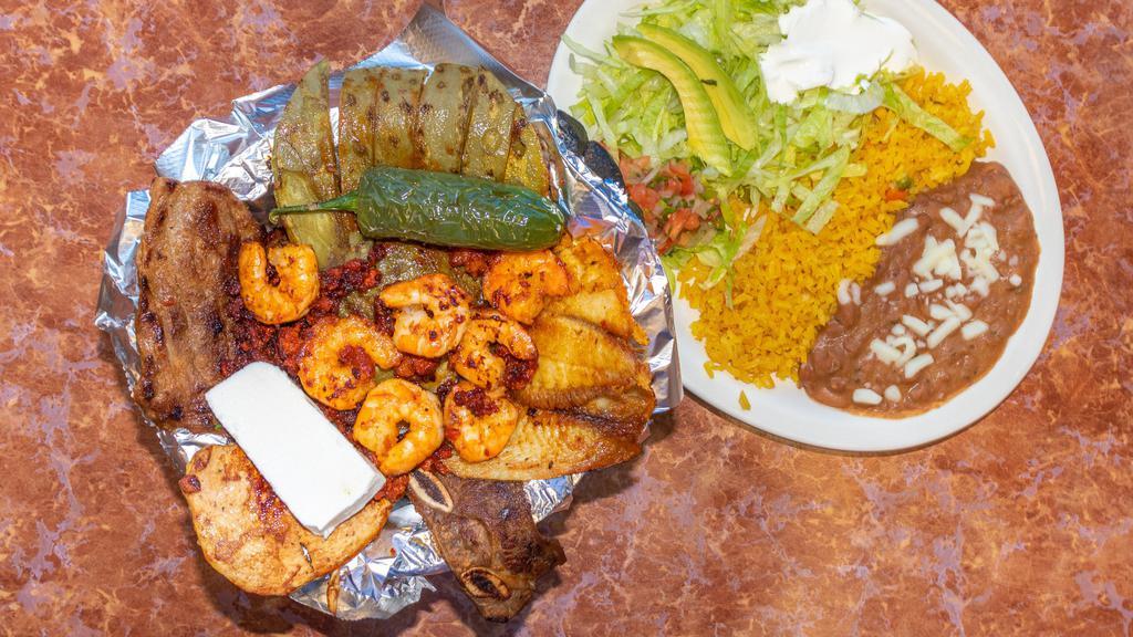 Molcajete · Grilled steak chicken, rib, fish shrimp and Mexican chorizo served with nopales and cheese.