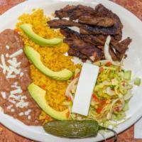Carne Hondureña · Served with rice beans and cheese.