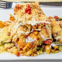 Katori Papri Chaat · Dish with typical Indian flavors filled with the quintessential chaat ingredients like boile...
