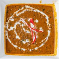 Dal Makhani · India’s most special & popular dal-black lentils cooked with Indian spices, butter, and cream.