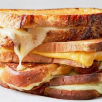 Grilled Cheese · Melting cheeses on a bagel/bread on grill with butter