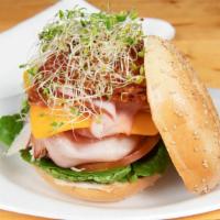 Turkey Ham Club · Roasted Turkey, Baked Ham, Bacon and Swiss cheese with Lettuce, Tomato, Onion, Mayo and Must...