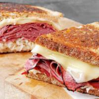Reuben · Grilled Corned Beef, Sauerkraut, 2 Pieces of Swiss cheese, and Russian dressing on Rye bread...