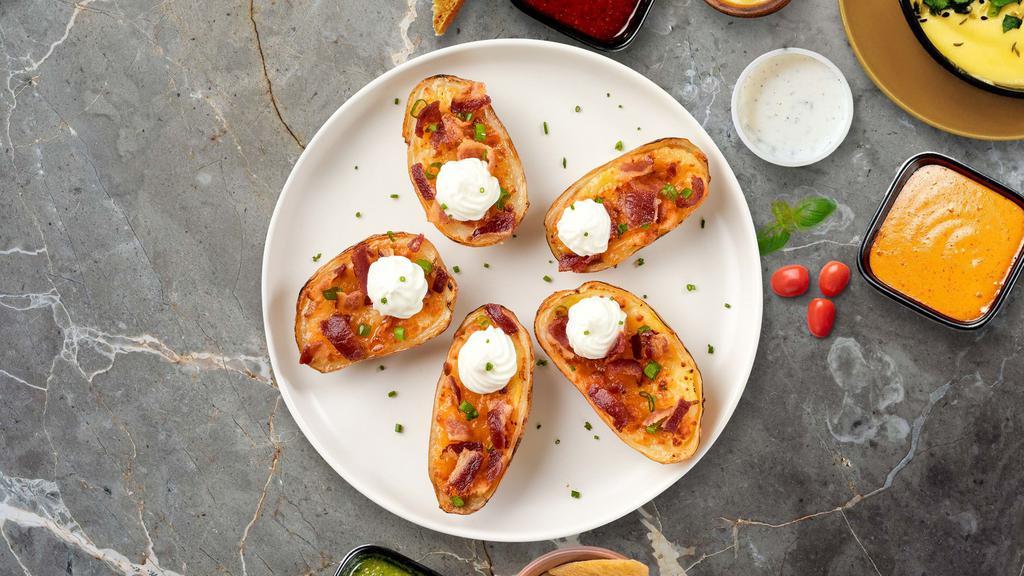 Perfect Potato Skin · Deep-fried and crispy hand-scooped potato skins. Served with sour cream.