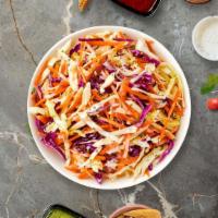Coleslaw Breaker · Shredded cabbage and carrots dressed in mayonnaise and apple cider vinegar.