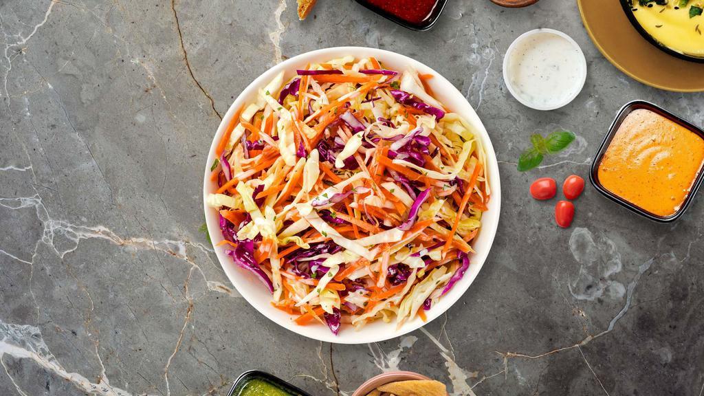 Coleslaw Breaker · Shredded cabbage and carrots dressed in mayonnaise and apple cider vinegar.