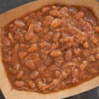 Smokin' Bbq Beans · Pit fire cooked pinto beans mixed with our house shake, bacon and smoked meat shavings.