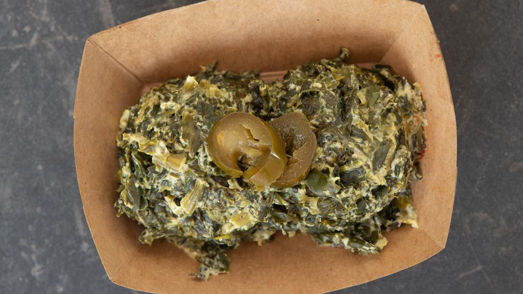 Jalapeño Creamed Spinach · Spicy creamed spinach made with salt, pepper, and garlic shake with jalapenos over the fire.