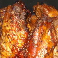 Wings  · 6 piece grilled wings, Jerk or BBQ flavored