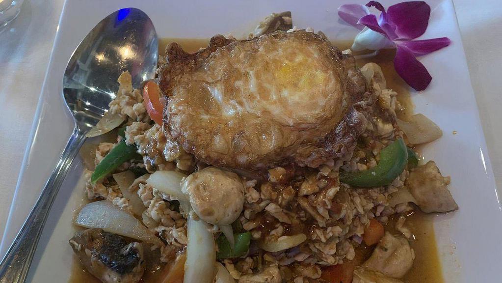 Pad Krapow (Mild Heat) · Ground chicken, beef, or pork stir-fried with fresh chilies and basil leaves in special mild chili sauce rice and topped with an egg over easy.
