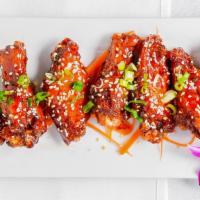 Sticky Wings (Or Plain) · Deep fried chicken wings sautéed in a mild sticky sweet chili paste sauce.