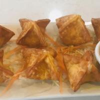 Crab Rangoons · House-made with seasoned cream cheese, crabmeat, scallions, and cilantro served with our swe...