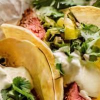 Tacos Al Carbon · 2 Soft Flour Tortillas rolled with your preference. Served with Rice, Beans, Sour Cream, and...