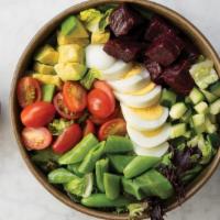 Goddess Salad · A bed of organic mixed greens topped with organic grape tomatoes, sliced hardboiled egg, mar...