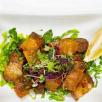 Sweet 'N Sour Chicharrón · Dominican-style fried pork belly. Topped with sweet chili sauce.