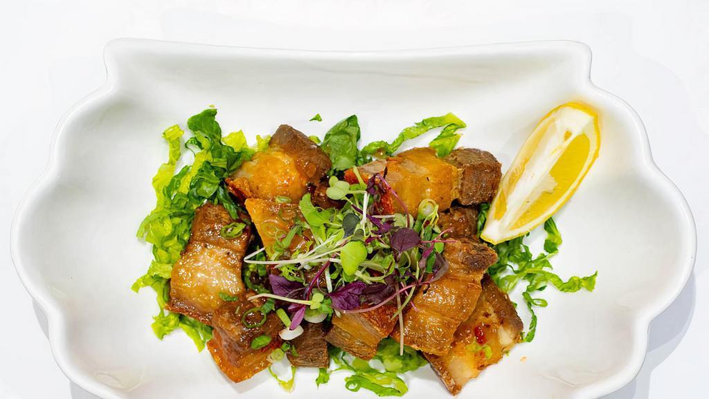 Sweet 'N Sour Chicharrón · Dominican-style fried pork belly. Topped with sweet chili sauce.