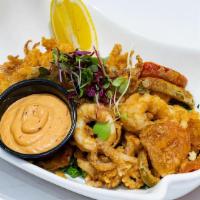 Crispy Calamari · Our famous deep-fried calamari with hot cherry peppers and chipotle sauce.