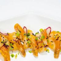 Rock Shrimp · Deep-fried shrimp served with Sambal aioli. Topped with sesame seed.