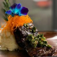 Churrasco · Our delicious outside skirt steak cooked on the grill, topped with chimichurri sauce. Served...
