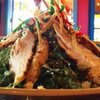 Chicken Tostada Salad · grilled chicken, romaine and mixed greens tossed with fresh tomatoes, hominy, fire roasted c...