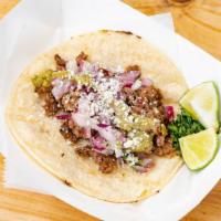 Steak · Grilled tenderloin meat, served in a corn tortilla with cilantro, onions, cotija cheese and ...