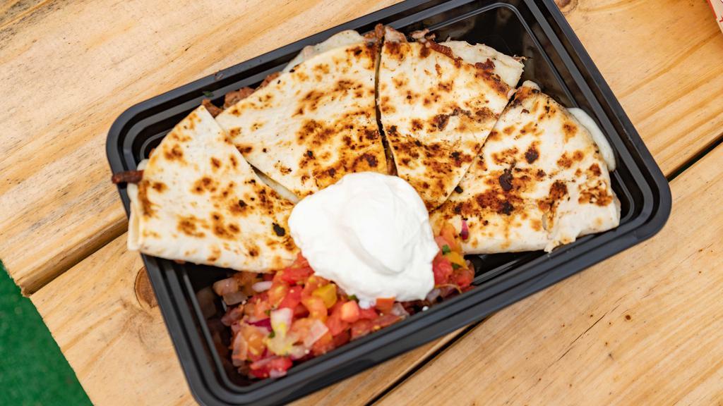 Plain Quesadilla · Grilled Flour Tortilla stuffed with melted mozzarella cheese.