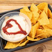 Queso · Eight oz. of melted white American cheese served with corn tortilla chips.