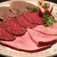 Meat Delicacy · A platter with an assortment of meats: Hungarian salami, beef tongue, house smoked meats.