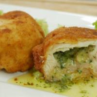 Chicken Kiev · Chicken breast stuffed with butter and herbs, breaded and lightly fried, giving it a light c...