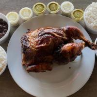 Whole Chicken With Beans And Rice · One whole chicken with two 8 ounce portions of black beans and two 8 ounce portions of rice.