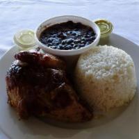 Quarter Chicken, Beans And Rice · Quarter of chicken with eight (8) ounce black beans  and rice.