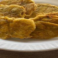 Tostones · Fried green plantains.